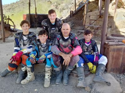 Doug with four young riders in gear after a ride